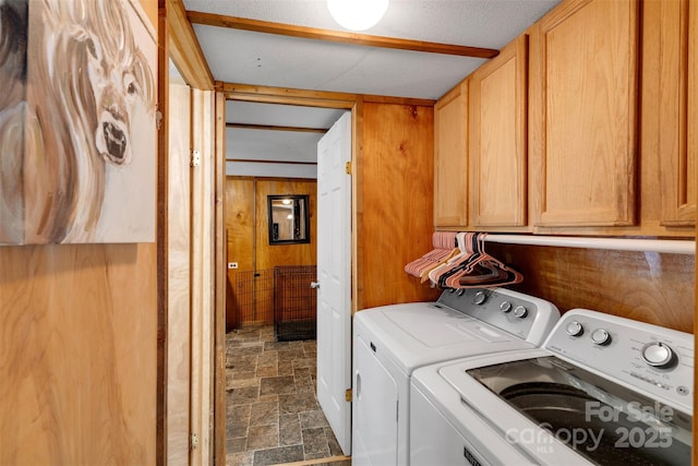 2289 Mccloud St, Denver, NC 28037 - laundry room with cabinet space, stone finish flooring, separate washer and dryer, and wood walls