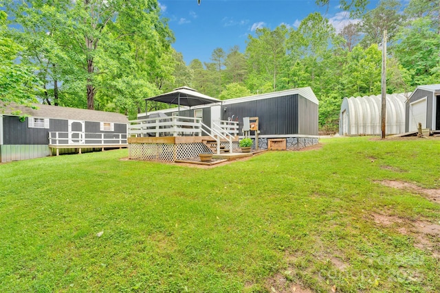 2289 Mccloud St, Denver, NC 28037 - view of grassy yard with an outbuilding, a deck, and view of scattered trees