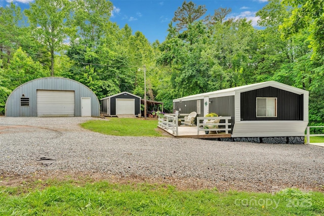 2289 Mccloud St, Denver, NC 28037 - view of yard with an outdoor structure, a garage, driveway, and a deck