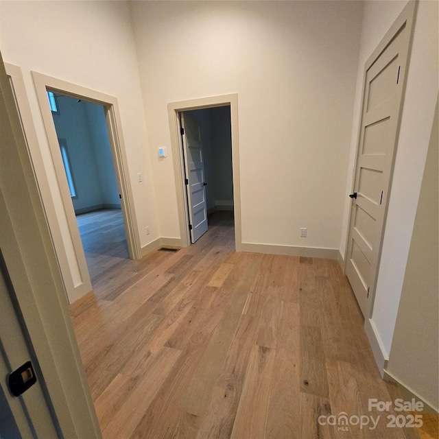 30 Sand Hill Rd, Asheville, NC 28806 - corridor with light wood-style flooring, baseboards, and a high ceiling