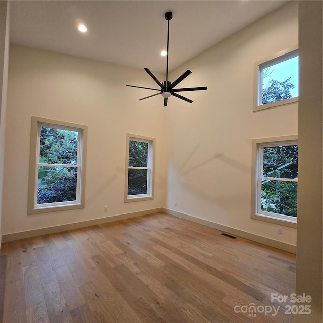 30 Sand Hill Rd, Asheville, NC 28806 - empty room featuring a ceiling fan, light wood finished floors, baseboards, recessed lighting, and a high ceiling