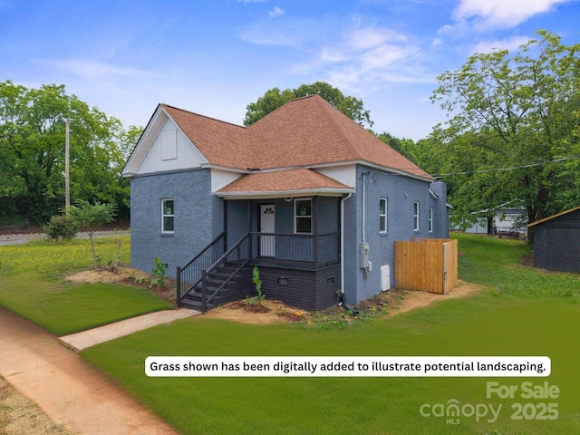 506 N Styers St, Cherryville, NC 28021 - view of front of home with brick siding, a front yard, covered porch, and a shingled roof
