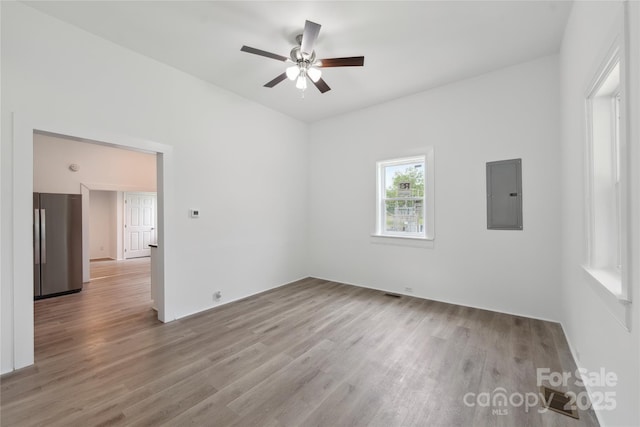 506 N Styers St, Cherryville, NC 28021 - unfurnished room with electric panel, wood finished floors, and ceiling fan