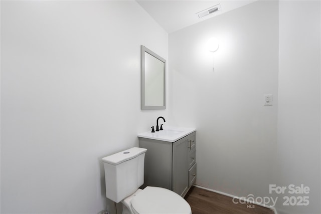 506 N Styers St, Cherryville, NC 28021 - half bath featuring toilet, vanity, wood finished floors, and baseboards