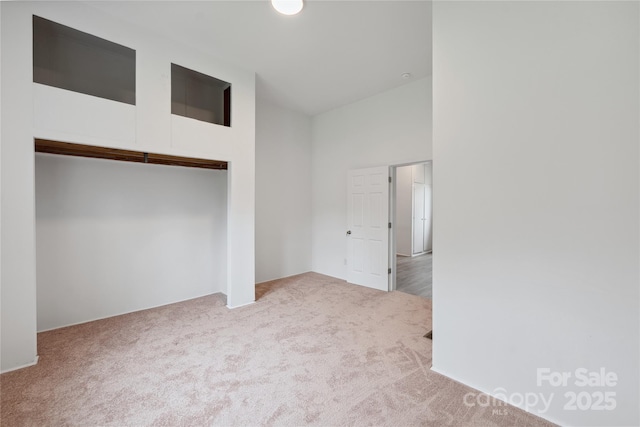 506 N Styers St, Cherryville, NC 28021 - unfurnished bedroom featuring carpet floors, a closet, and a towering ceiling