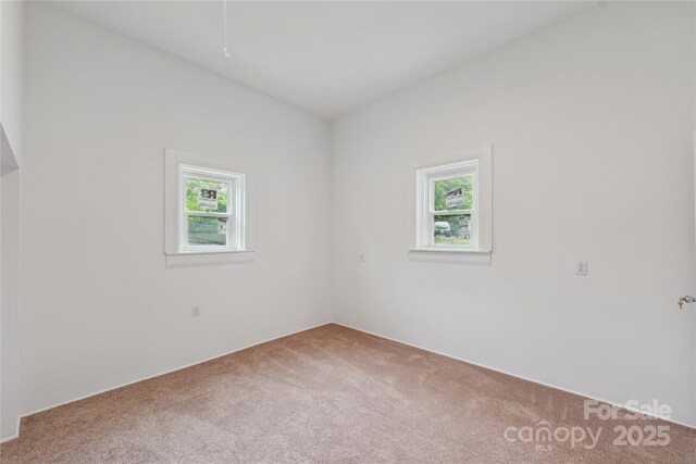 506 N Styers St, Cherryville, NC 28021 - empty room with carpet and healthy amount of natural light