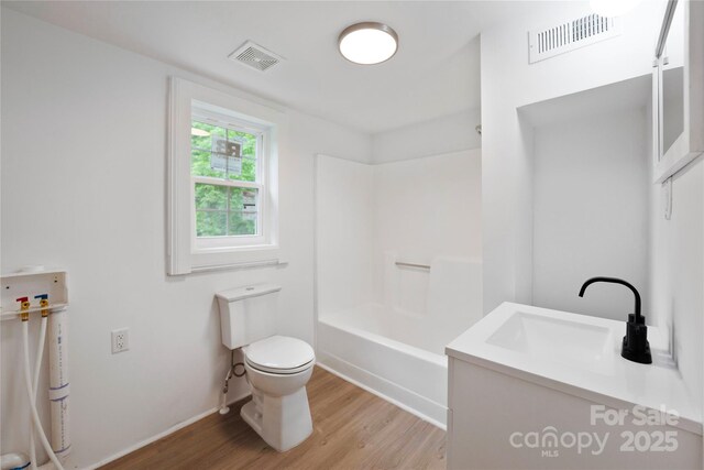 506 N Styers St, Cherryville, NC 28021 - bathroom with toilet, wood finished floors, vanity,  shower combination, and baseboards