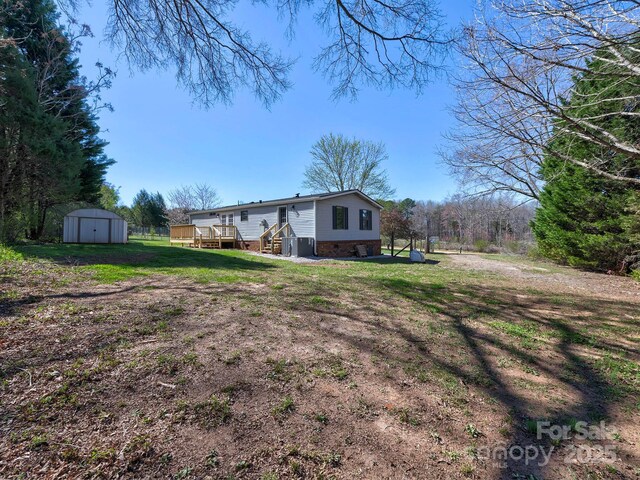 1038 Gold Mine Dr, Catawba, NC 28609 - view of grassy yard with a wooden deck