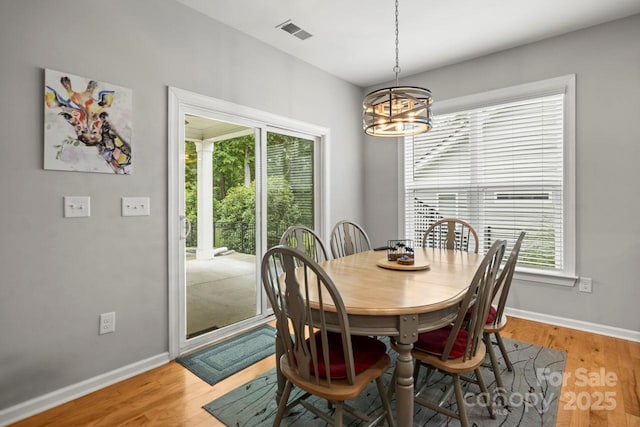 219 Broadleaf Dr, Denver, NC 28037 - dining area with a chandelier, plenty of natural light, baseboards, and light wood-style flooring