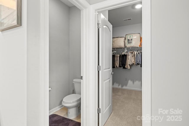 219 Broadleaf Dr, Denver, NC 28037 - bathroom with toilet and a walk in closet