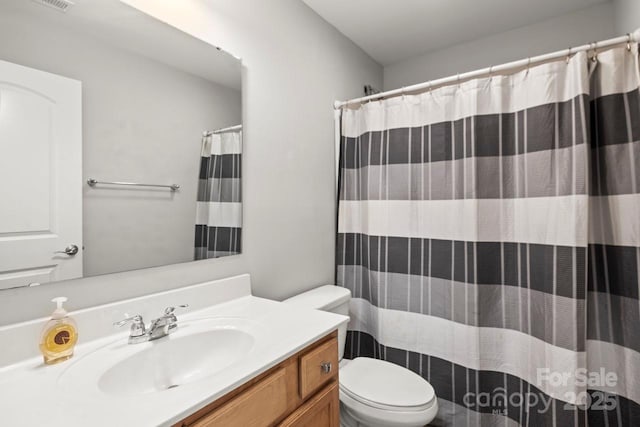 219 Broadleaf Dr, Denver, NC 28037 - full bathroom featuring toilet, vanity, and curtained shower