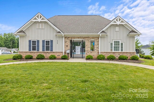 219 Broadleaf Dr, Denver, NC 28037 - craftsman inspired home with brick siding, board and batten siding, a front yard, and a shingled roof