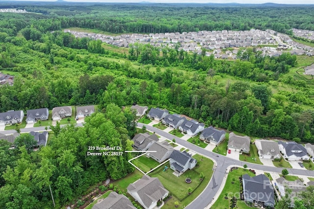 219 Broadleaf Dr, Denver, NC 28037 - aerial view of property and surrounding area featuring a heavily wooded area and nearby suburban area