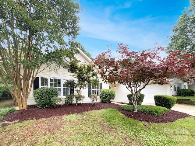 12307 Poplar Forest Dr, Charlotte, NC 28278 - obstructed view of property with a garage, a front yard, and concrete driveway