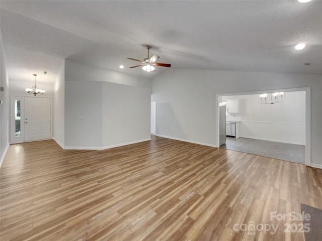12307 Poplar Forest Dr, Charlotte, NC 28278 - unfurnished living room with a chandelier, lofted ceiling, light wood-type flooring, baseboards, and ceiling fan