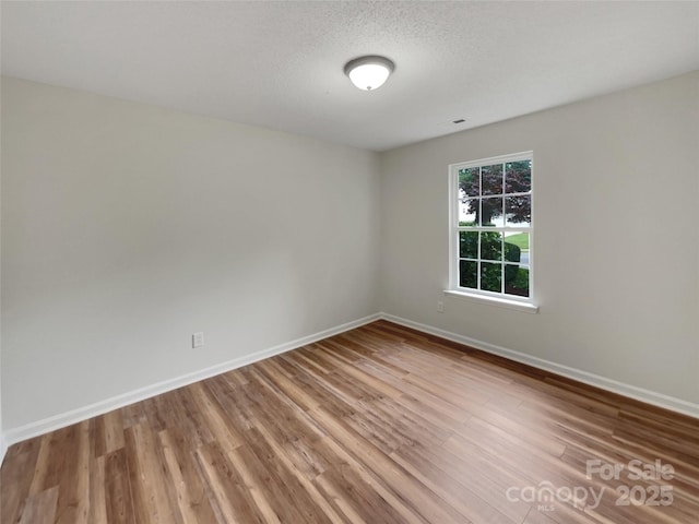 12307 Poplar Forest Dr, Charlotte, NC 28278 - empty room with wood finished floors and baseboards