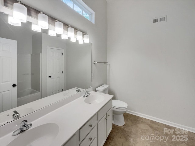 12307 Poplar Forest Dr, Charlotte, NC 28278 - full bath featuring toilet, double vanity, baseboards, and bathing tub / shower combination
