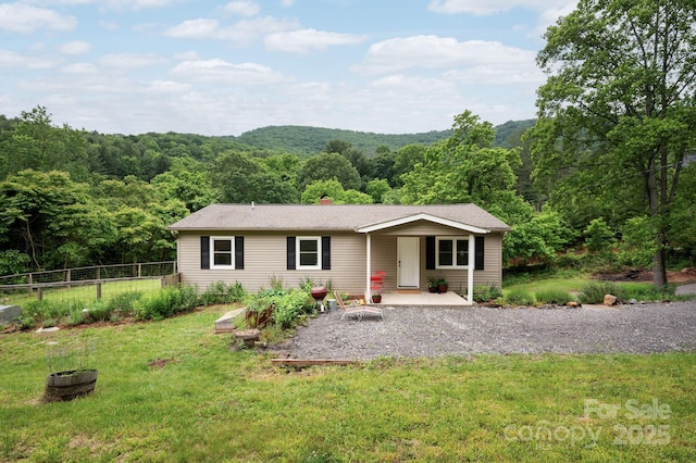 205 Cowan Cove Rd, Asheville, NC 28806 - single story home with a view of trees and a chimney