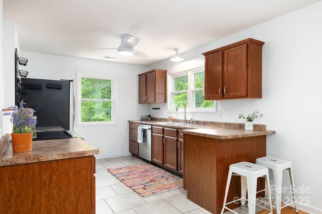 205 Cowan Cove Rd, Asheville, NC 28806 - kitchen with a sink, stainless steel dishwasher, refrigerator, ceiling fan, and light tile patterned floors