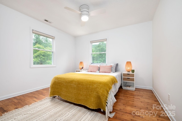 205 Cowan Cove Rd, Asheville, NC 28806 - bedroom with hardwood / wood-style floors, baseboards, and a ceiling fan