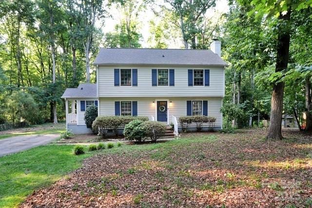 14027 Hackamore Dr, Matthews, NC 28105 - colonial-style house featuring a chimney