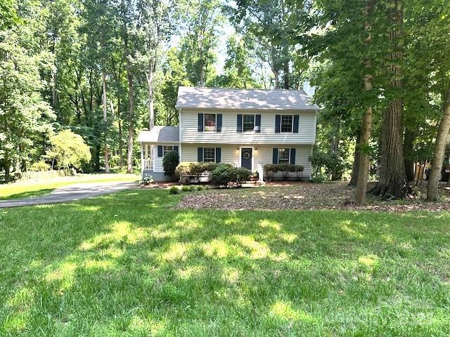 14027 Hackamore Dr, Matthews, NC 28105 - colonial house with a front yard