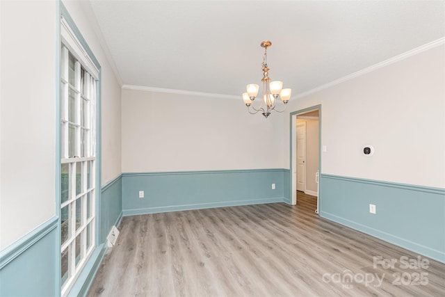 14027 Hackamore Dr, Matthews, NC 28105 - unfurnished room with a chandelier, ornamental molding, and wood finished floors