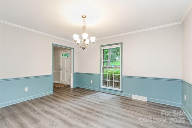 14027 Hackamore Dr, Matthews, NC 28105 - unfurnished room featuring a chandelier, ornamental molding, and wood finished floors