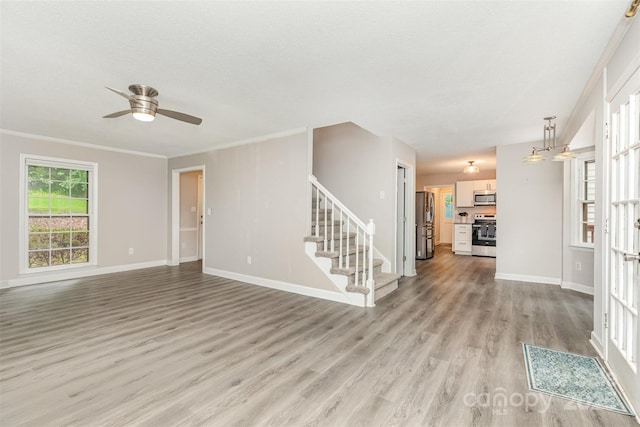 14027 Hackamore Dr, Matthews, NC 28105 - unfurnished living room featuring stairs, light wood finished floors, ceiling fan, and crown molding