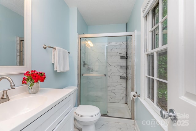 14027 Hackamore Dr, Matthews, NC 28105 - bathroom with marble look tiles, a shower stall, vanity, and a textured ceiling