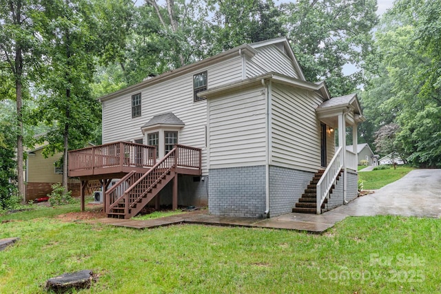 14027 Hackamore Dr, Matthews, NC 28105 - rear view of property featuring stairs, a wooden deck, a yard, and view of scattered trees