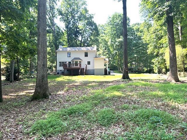 14027 Hackamore Dr, Matthews, NC 28105 - view of yard with a deck and stairway