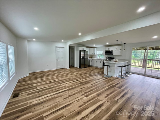 117 Autumn Woods Dr, Kings Mountain, NC 28086 - unfurnished living room with wood finished floors, recessed lighting, and baseboards