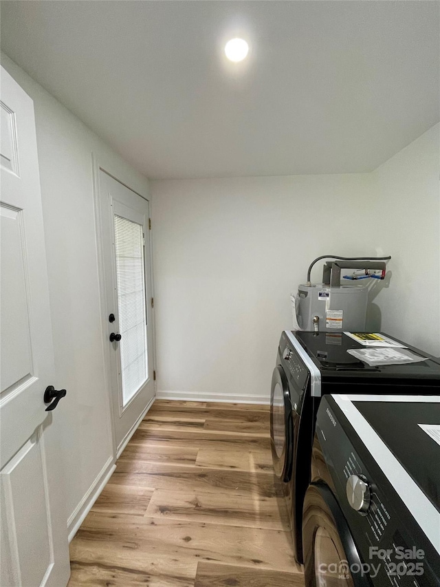 117 Autumn Woods Dr, Kings Mountain, NC 28086 - laundry room featuring water heater, washer and dryer, light wood-type flooring, and baseboards