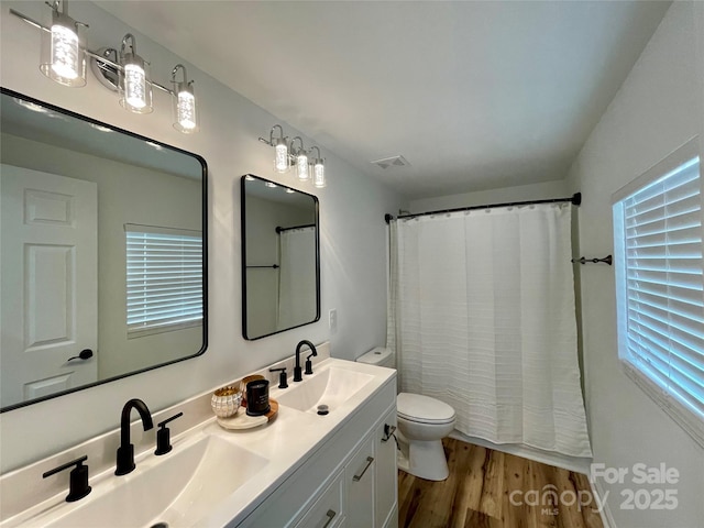 117 Autumn Woods Dr, Kings Mountain, NC 28086 - bathroom featuring wood finished floors, toilet, double vanity, and a shower with shower curtain