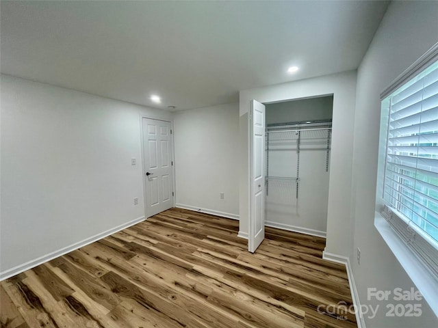 117 Autumn Woods Dr, Kings Mountain, NC 28086 - unfurnished bedroom featuring wood finished floors, recessed lighting, a closet, and baseboards