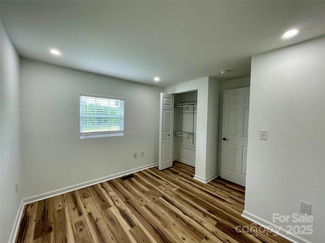 117 Autumn Woods Dr, Kings Mountain, NC 28086 - unfurnished bedroom with wood finished floors, baseboards, recessed lighting, and a closet