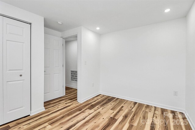 117 Autumn Woods Dr, Kings Mountain, NC 28086 - unfurnished bedroom with light wood-style flooring and recessed lighting