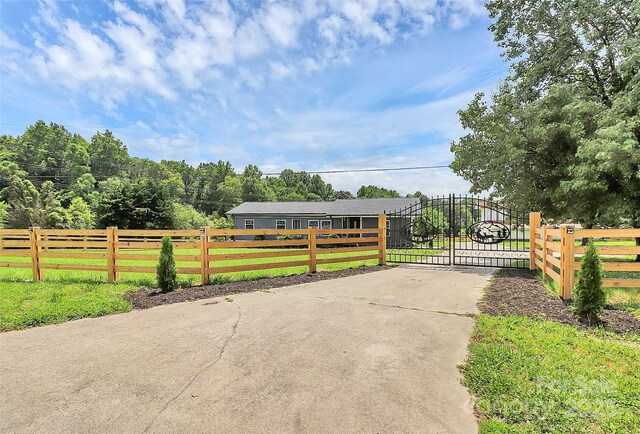 117 Autumn Woods Dr, Kings Mountain, NC 28086 - view of concrete driveway with a gate and a gated entry