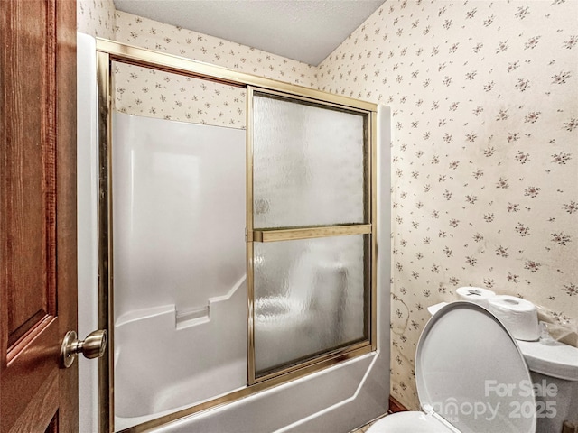 1700 Abbottsford Dr, Kernersville, NC 27284 - bathroom featuring wallpapered walls, toilet, and enclosed tub / shower combo