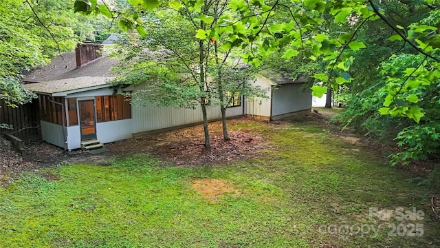 1700 Abbottsford Dr, Kernersville, NC 27284 - view of grassy yard with a sunroom