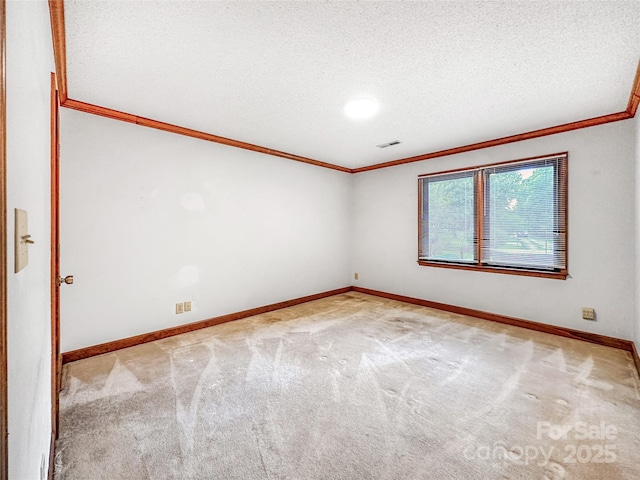 1700 Abbottsford Dr, Kernersville, NC 27284 - carpeted empty room featuring ornamental molding, baseboards, and a textured ceiling