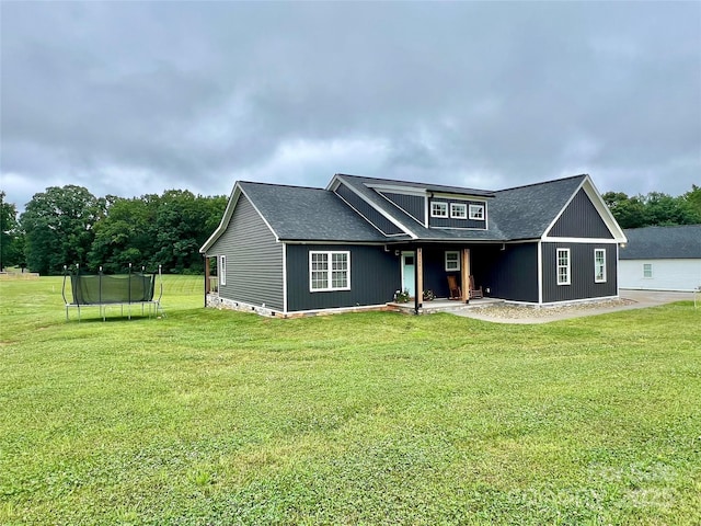 7133 Church Rd, Taylorsville, NC 28681 - view of front of house with a trampoline and a front lawn