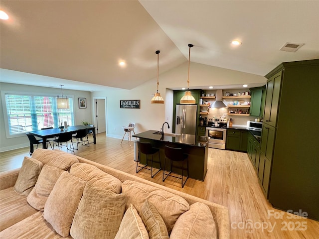 7133 Church Rd, Taylorsville, NC 28681 - kitchen featuring green cabinets, stainless steel appliances, open shelves, open floor plan, and light wood-style flooring