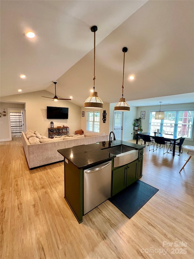 7133 Church Rd, Taylorsville, NC 28681 - kitchen with dishwasher, dark countertops, a sink, green cabinets, and light wood finished floors