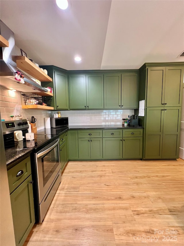 7133 Church Rd, Taylorsville, NC 28681 - kitchen with green cabinetry, electric stove, decorative backsplash, light wood-type flooring, and recessed lighting