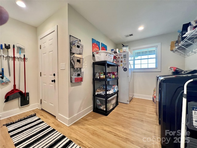 7133 Church Rd, Taylorsville, NC 28681 - laundry room with light wood-type flooring, baseboards, recessed lighting, and washer and clothes dryer