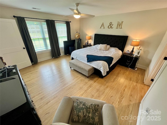 7133 Church Rd, Taylorsville, NC 28681 - bedroom with light wood-style floors, baseboards, and ceiling fan