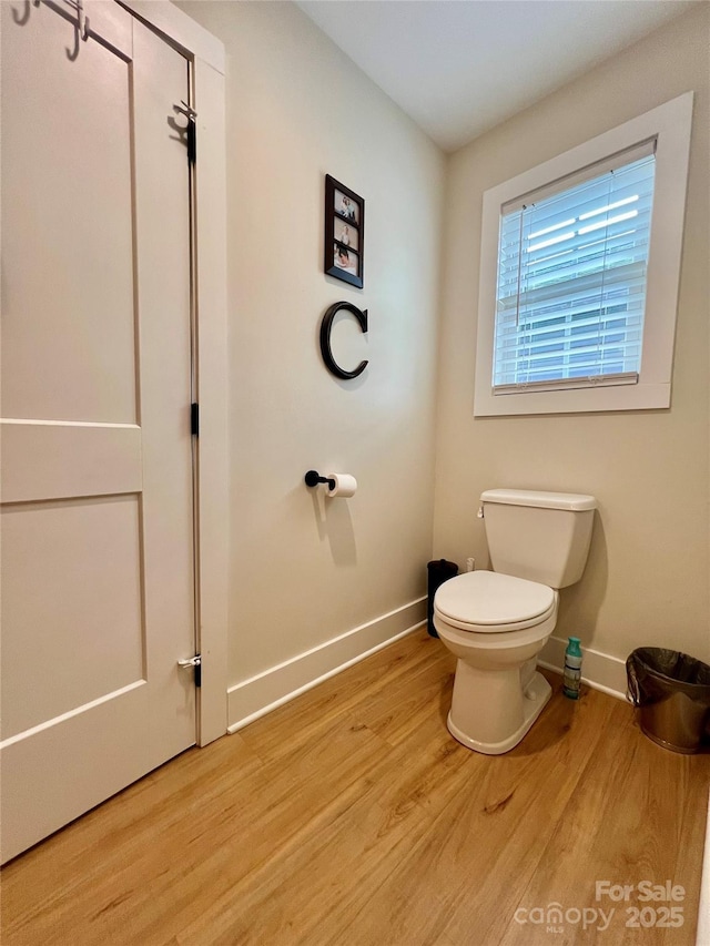 7133 Church Rd, Taylorsville, NC 28681 - bathroom with baseboards, toilet, and wood finished floors