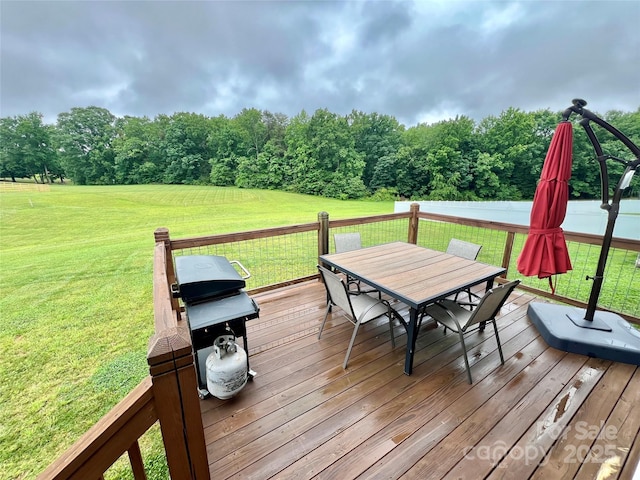 7133 Church Rd, Taylorsville, NC 28681 - deck featuring outdoor dining space, a yard, grilling area, and a wooded view